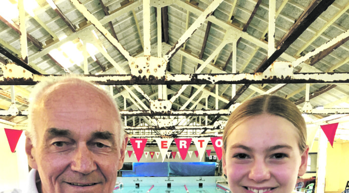 Carterton Swimming Club star Ava Wilson and coach Russell Geange.  PHOTO/FILE