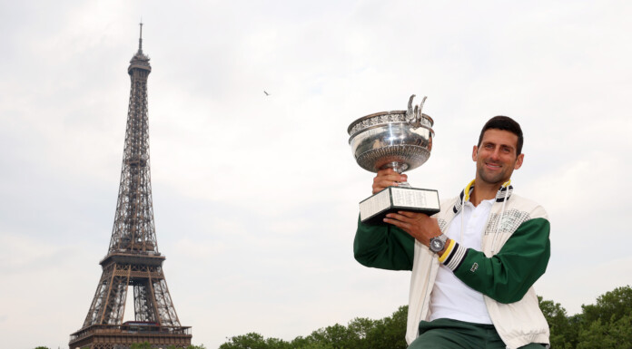 Novak Djokovic shows off the French Open trophy after his 23rd grand slam victory. PHOTO/GETTY IMAGES
